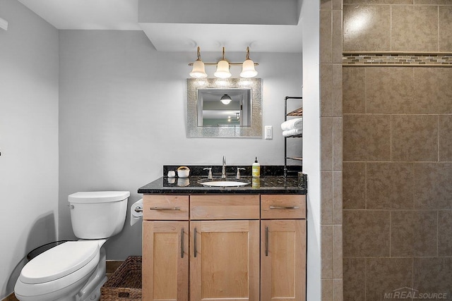 bathroom with toilet and vanity