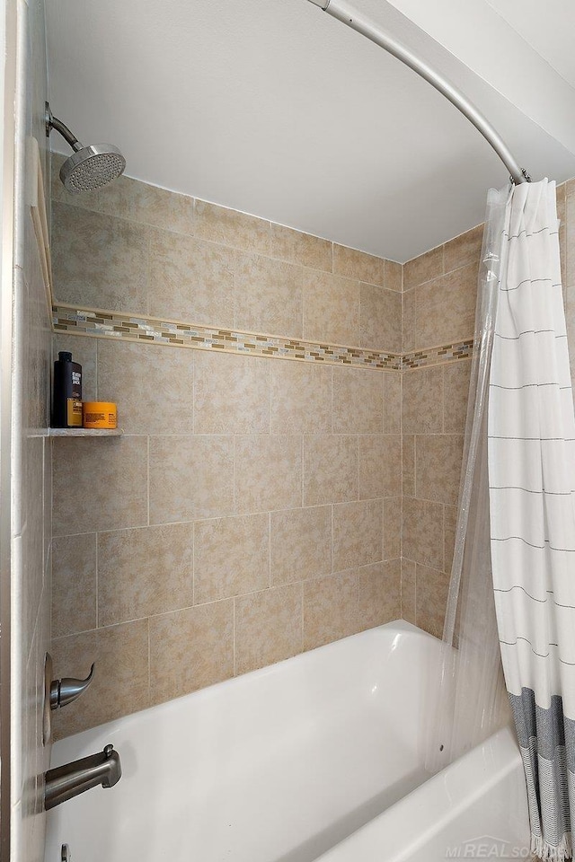 full bathroom with shower / tub combo