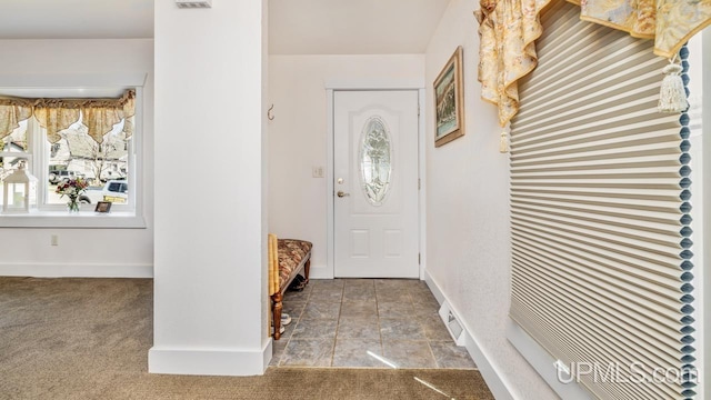 entryway featuring baseboards