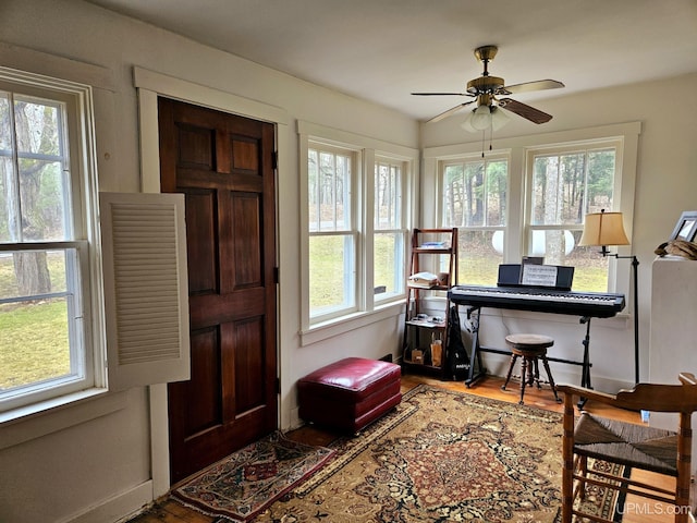 N15505 Black River Rd, Ironwood, MI 49938 - home office featuring plenty of natural light, ceiling fan, and wood finished floors