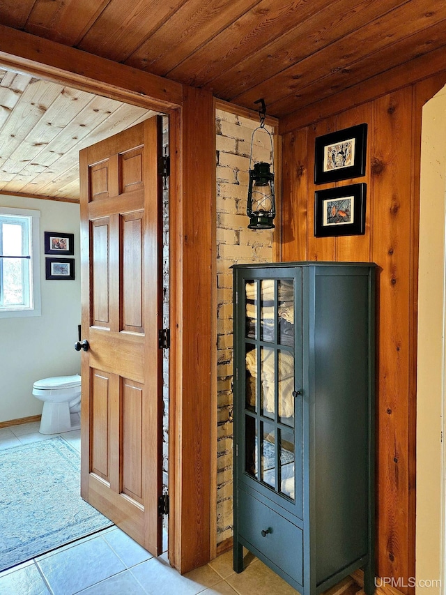 N15505 Black River Rd, Ironwood, MI 49938 - foyer with wooden ceiling, light tile patterned floors, and wooden walls