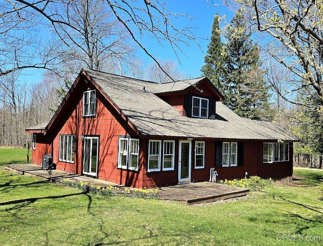 N15505 Black River Rd, Ironwood, MI 49938 - rear view of property featuring a yard and a shingled roof