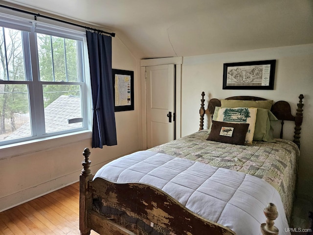 N15505 Black River Rd, Ironwood, MI 49938 - bedroom featuring vaulted ceiling, wood finished floors, and baseboards