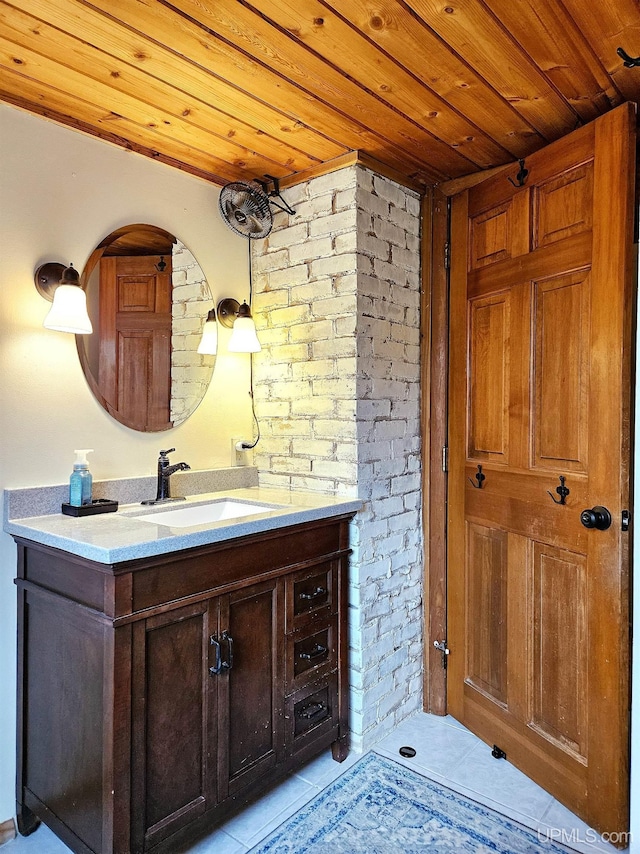 N15505 Black River Rd, Ironwood, MI 49938 - bathroom featuring wooden ceiling, vanity, tile patterned flooring, and brick wall