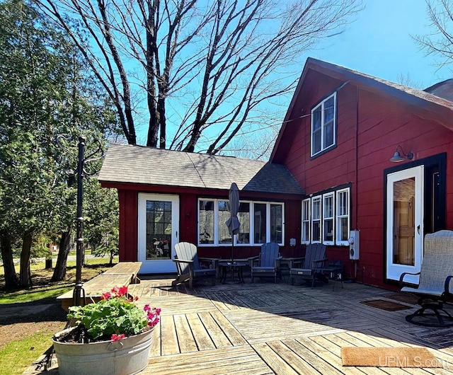 N15505 Black River Rd, Ironwood, MI 49938 - rear view of house featuring a wooden deck and roof with shingles