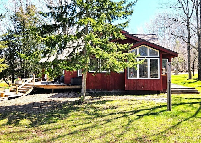 N15505 Black River Rd, Ironwood, MI 49938 - view of side of home with a deck and a yard