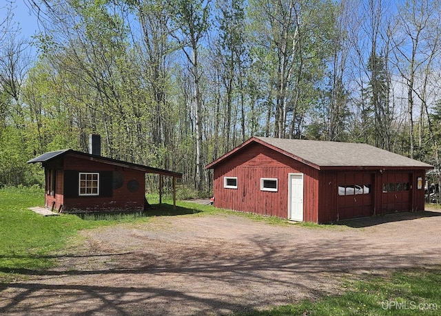 N15505 Black River Rd, Ironwood, MI 49938 - view of outbuilding featuring driveway and a view of trees