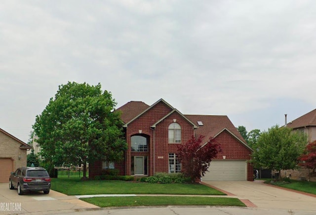 traditional-style house featuring concrete driveway, an attached garage, and brick siding