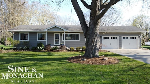 ranch-style house with a garage, driveway, and a front yard