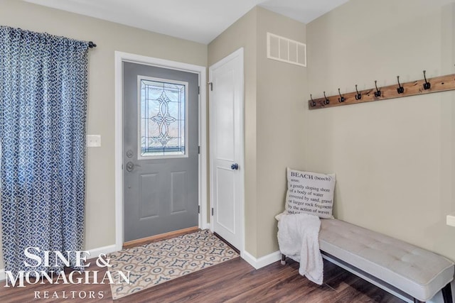 mudroom featuring dark wood finished floors and baseboards