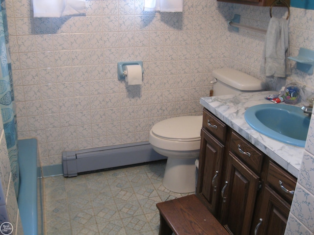bathroom with a baseboard radiator, toilet, tile patterned flooring, vanity, and a shower with shower curtain