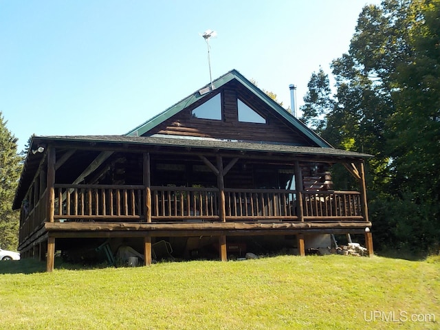 180 Wpa Rd, Crystal Falls, MI 49920 - log cabin featuring a front lawn, log siding, and a deck