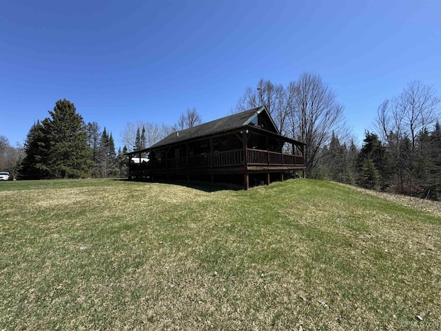 180 Wpa Rd, Crystal Falls, MI 49920 - view of green lawn with a deck