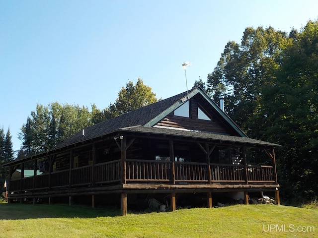 180 Wpa Rd, Crystal Falls, MI 49920 - rear view of house featuring a lawn