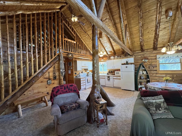 180 Wpa Rd, Crystal Falls, MI 49920 - living area with wood ceiling, light carpet, beamed ceiling, and high vaulted ceiling