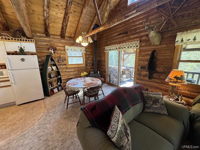 180 Wpa Rd, Crystal Falls, MI 49920 - living area with a wood stove, wood ceiling, beam ceiling, log walls, and high vaulted ceiling