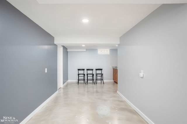 finished below grade area with baseboards and recessed lighting