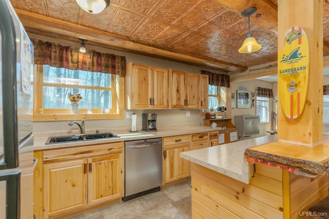 112 Little Deer Rd, Iron River, MI 49935 - kitchen featuring stainless steel appliances, a sink, an ornate ceiling, light brown cabinetry, and light countertops