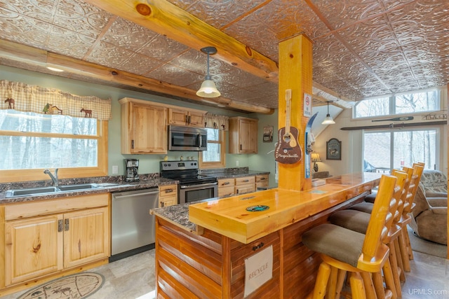 112 Little Deer Rd, Iron River, MI 49935 - kitchen featuring an ornate ceiling, stainless steel appliances, a sink, and pendant lighting
