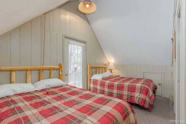 112 Little Deer Rd, Iron River, MI 49935 - bedroom featuring vaulted ceiling, carpet, and wood walls