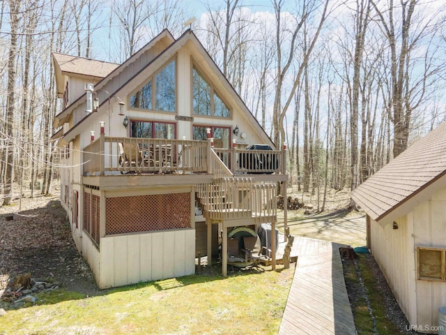 112 Little Deer Rd, Iron River, MI 49935 - rear view of property with a wooden deck and stairway