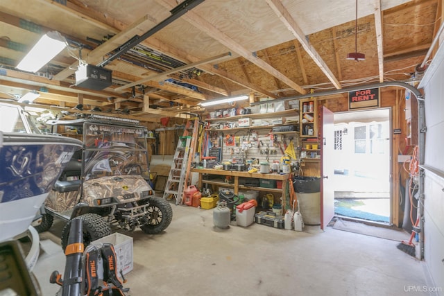 112 Little Deer Rd, Iron River, MI 49935 - garage featuring a garage door opener and a workshop area