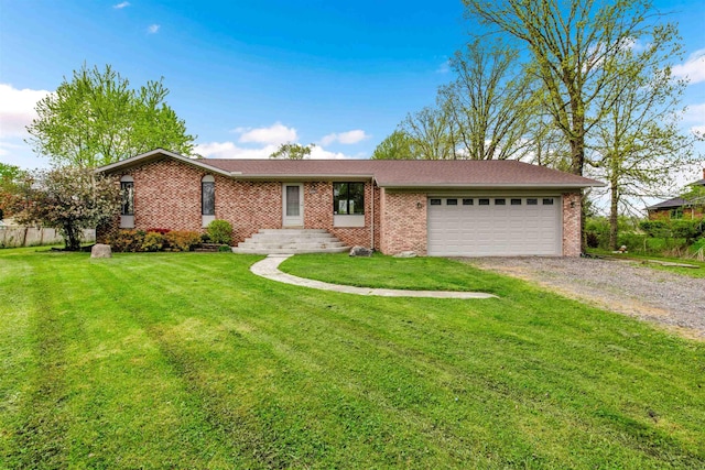 single story home with dirt driveway, brick siding, a garage, and a front yard