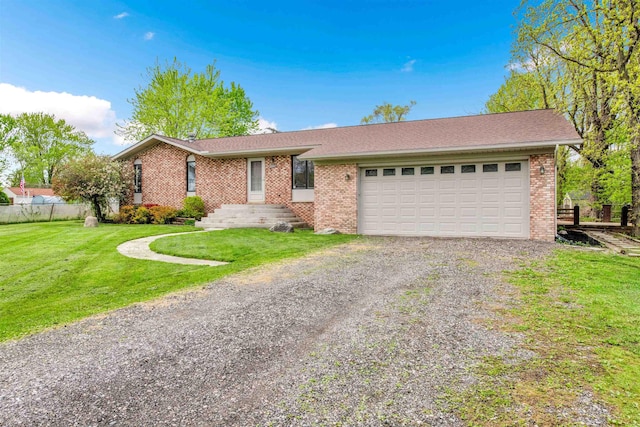 ranch-style house featuring driveway, brick siding, and an attached garage