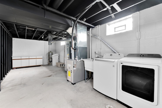 laundry area featuring washer and dryer and healthy amount of natural light