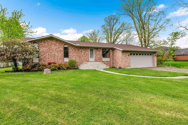 ranch-style home featuring driveway, an attached garage, brick siding, and a front lawn