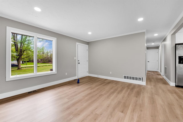unfurnished living room with light wood-type flooring, recessed lighting, baseboards, and ornamental molding