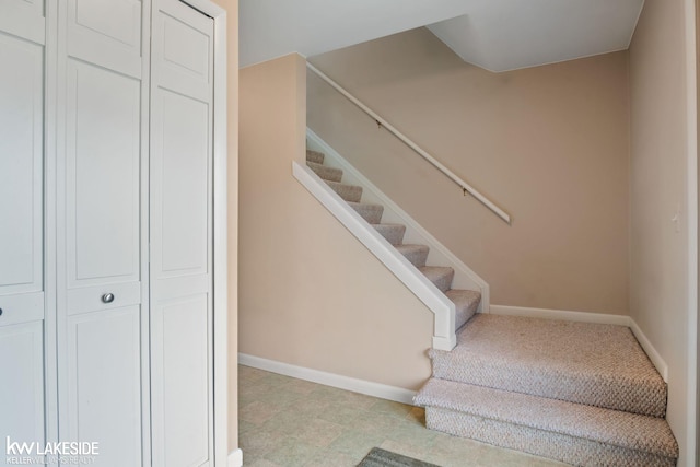 stairway featuring baseboards