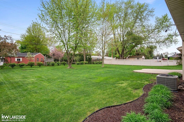 view of yard with central AC