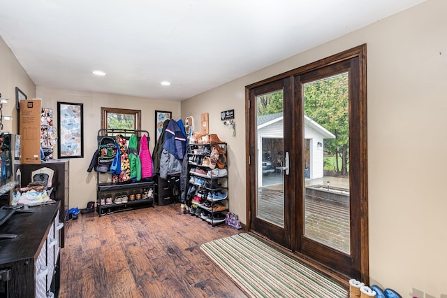 doorway to outside with wood finished floors, recessed lighting, and french doors