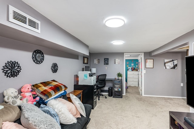 carpeted home office featuring baseboards