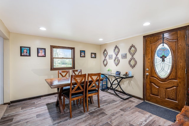 dining area featuring plenty of natural light, wood finished floors, recessed lighting, and baseboards