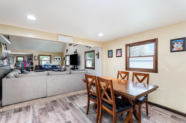 dining room featuring light wood-type flooring, recessed lighting, and baseboards