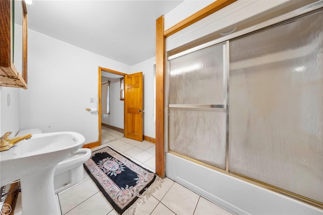 full bath with tile patterned flooring and combined bath / shower with glass door