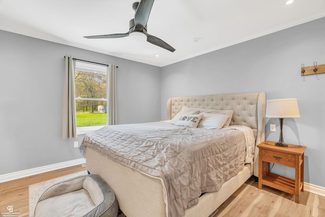 bedroom featuring baseboards, light wood finished floors, a ceiling fan, and recessed lighting