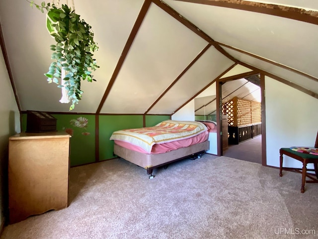 carpeted bedroom featuring vaulted ceiling