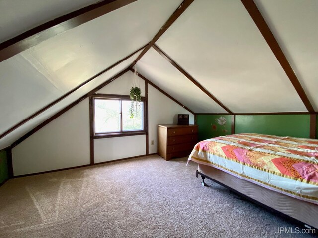 carpeted bedroom with vaulted ceiling