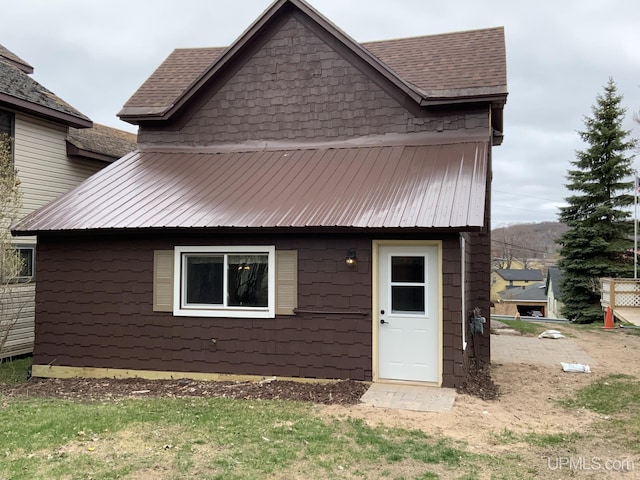 122 Rock St, Negaunee, MI 49866 - view of front of home featuring metal roof and roof with shingles