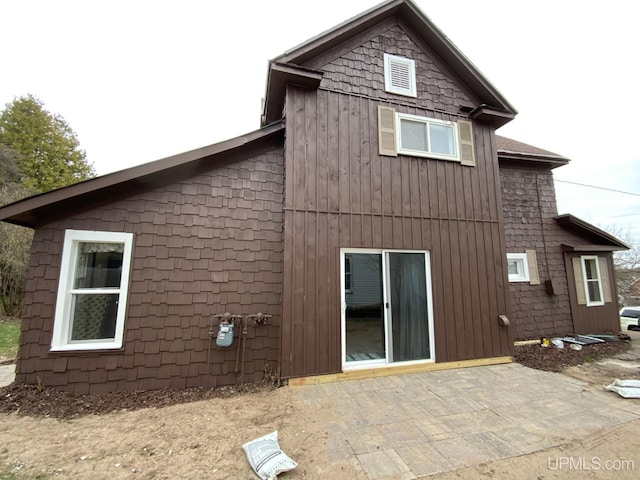 122 Rock St, Negaunee, MI 49866 - rear view of house with a patio