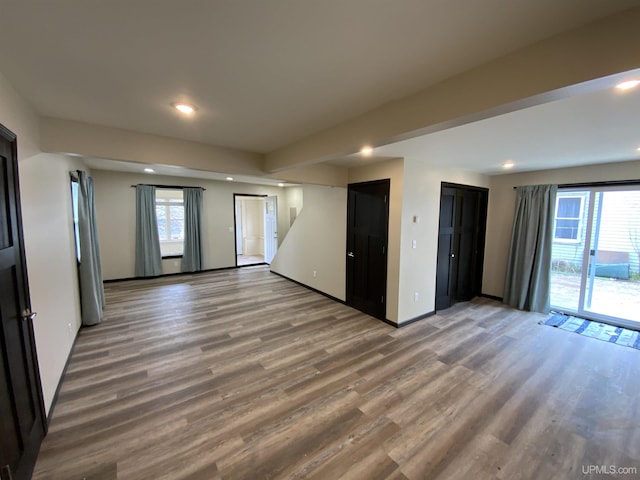 122 Rock St, Negaunee, MI 49866 - empty room with light wood-type flooring, recessed lighting, baseboards, and stairs