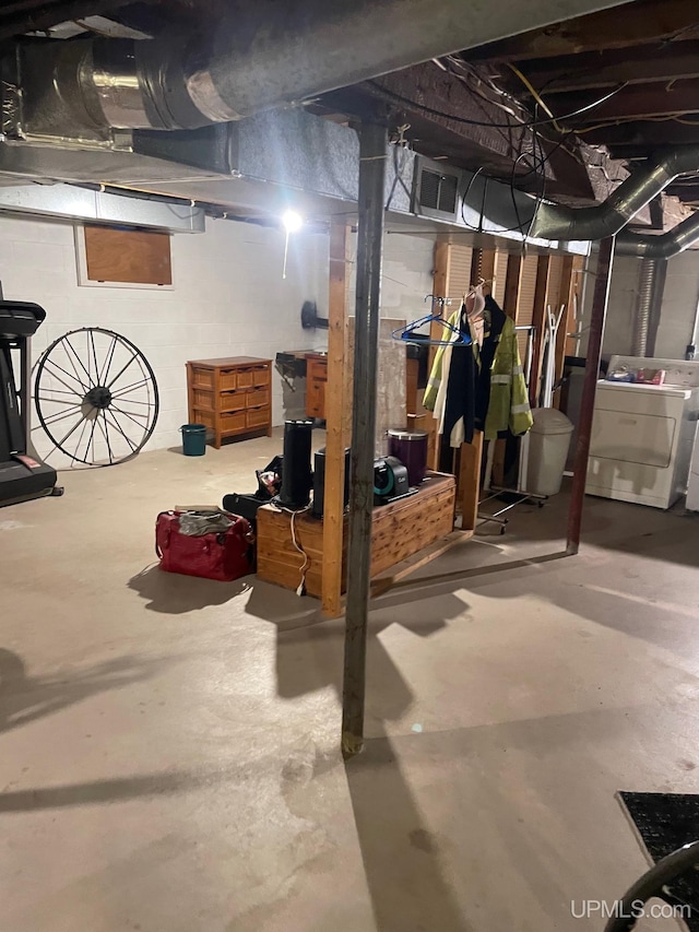 unfinished below grade area with independent washer and dryer