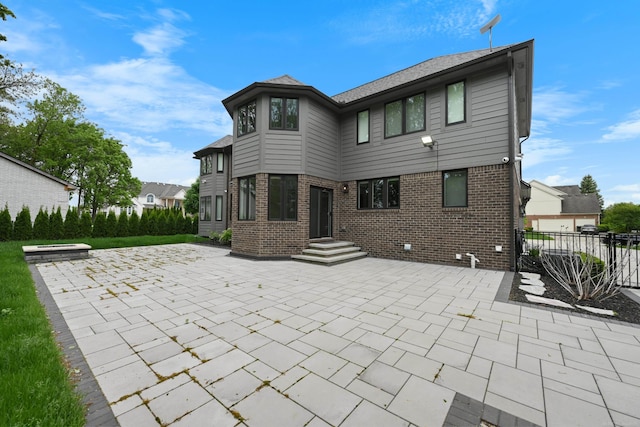 835 Crestwood Ln, Rochester Hills, MI 48309 - rear view of property featuring brick siding and a patio area