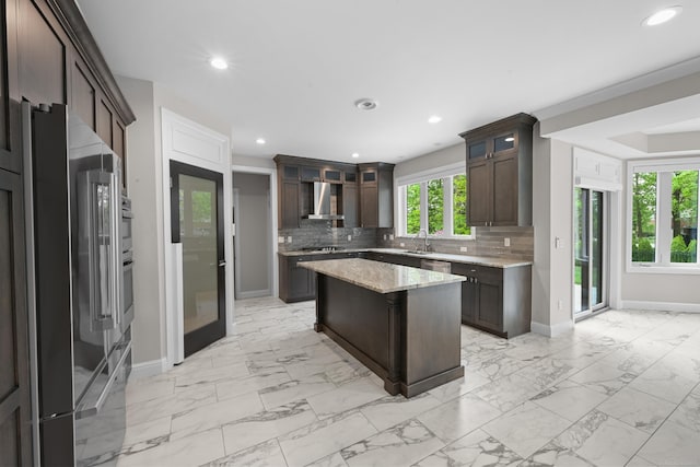 835 Crestwood Ln, Rochester Hills, MI 48309 - kitchen featuring wall chimney exhaust hood, baseboards, stainless steel appliances, light marble finish flooring, and recessed lighting