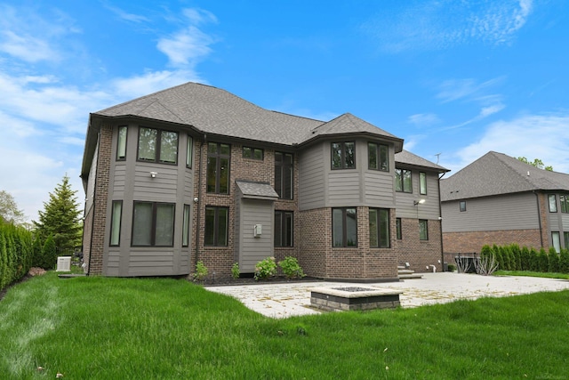 835 Crestwood Ln, Rochester Hills, MI 48309 - back of house with a patio area, a yard, brick siding, and a shingled roof
