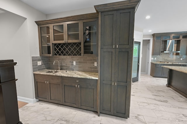 835 Crestwood Ln, Rochester Hills, MI 48309 - indoor wet bar featuring wall chimney exhaust hood, light marble finish flooring, decorative backsplash, recessed lighting, and baseboards