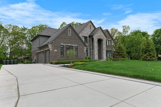 835 Crestwood Ln, Rochester Hills, MI 48309 - french country inspired facade with brick siding, driveway, and a front yard